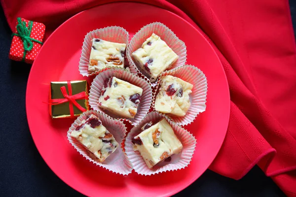 Christmas fudge with small gifts — Stock Photo, Image