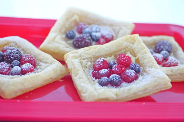 Servings of berry pastries — Stock Photo, Image