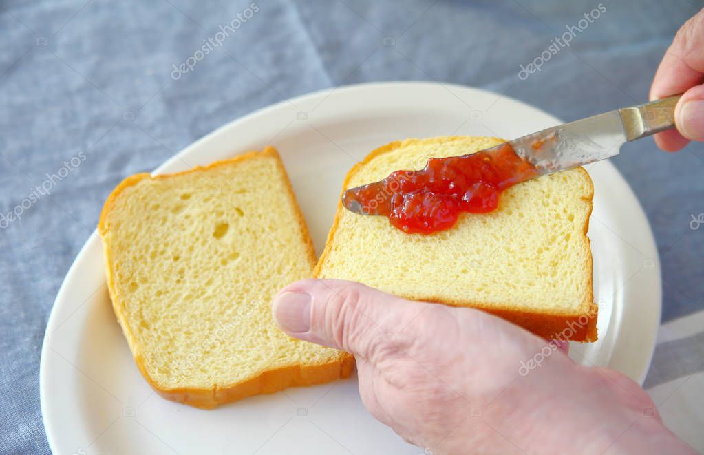 Strawberry jam spread on bread — Stock Photo © aliced 164447094