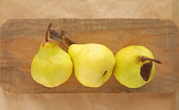 Pears on a wood surface — Stock Photo, Image