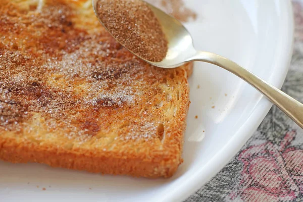 Cinnamon toast with spoon — Stock Photo, Image