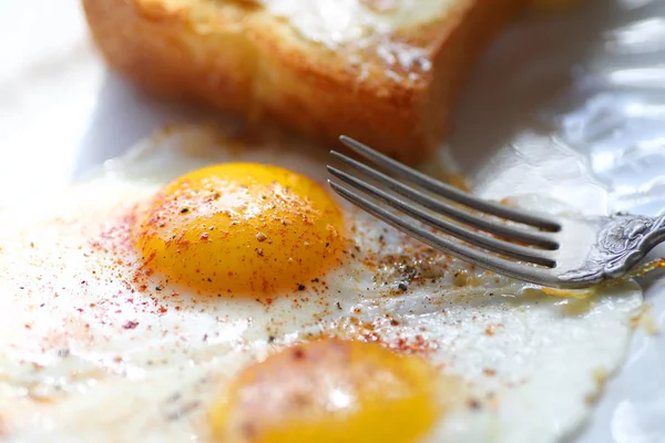 Closeup of fried eggs with toast — Stock Photo, Image