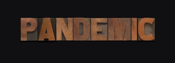 Word Pandemic Letterpress Wood Letters Black Background — Stock Photo, Image