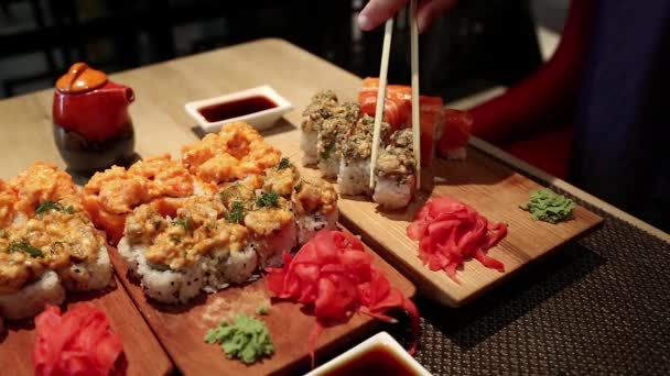 Man eats japanese food — Stock Video