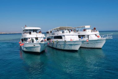 EGYPT, SINAI, SHARM EL SHEIKH, DECEMBER 7, 2019: People on pleasure boat in Red Sea near coast of Sharm El Sheikh city