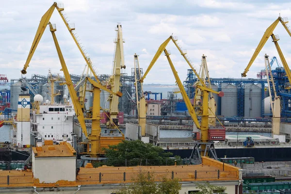 UKRAINE, ODESSA, SEPTEMBER 7, 2019: Yellow cranes in Odessa sea port - largest Ukrainian port and one of largest ports in Black Sea basin