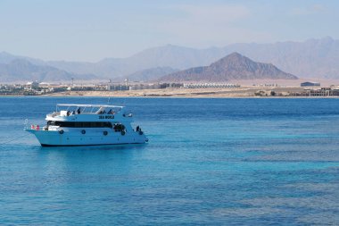 EGYPT, SINAI, SHARM EL SHEIKH, DECEMBER 7, 2019: Pleasure boat in Red Sea near coast of Sharm El Sheikh city