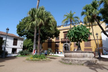 TENERIFE ISLAND, ICOD DE LOS VINOS, CANARY ISLANDS, SPAIN, OCTOBER 4, 2019: People on the Plaza de la Pila Square in Icod de los Vinos, Tenerife, Canary islands