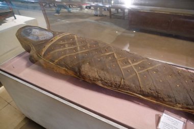 CAIRO, EGYPT, DECEMBER 11, 2019: Ancient mummie of a Woman with portrait in museum of Egyptian antiquities in Cairo, known commonly as the Egyptian museum or museum of Cairo