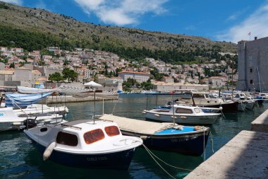 CROATIA, DUBROVNIK, JUNE 28, 2019: Boats in harbour in old town of Dubrovnik, Croatia
