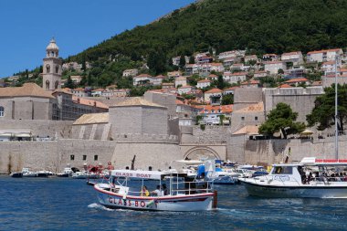 CROATIA, DUBROVNIK, JUNE 30, 2019: Motor boats in harbour in old town of Dubrovnik, Croatia, Adriatic Sea