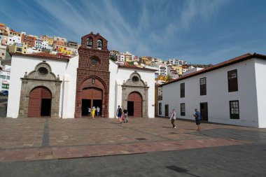 LA GOMERA ISLAND, SAN SEBASTIAN, CANARY ISLANDS, SPAIN, OCTOBER 3, 2019: People near Church of Assumption or Iglesia de la Asuncion in San Sebastian city, La Gomera island, Canary islands