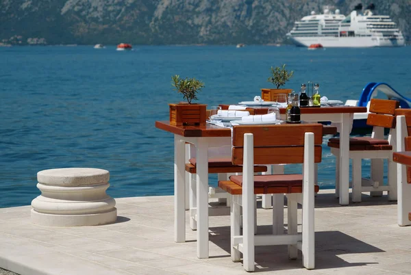 Table in restaurant with beautiful sea view, Bay of Kotor, Adriatic Sea, Montenegro