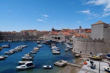 CROATIA, DUBROVNIK, JUNE 28, 2019: Boats in harbour in old town of Dubrovnik, Croatia