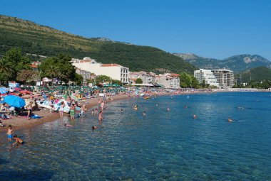 MONTENEGRO, PETROVAC, JULY 1, 2019: People on the beach in Petrovac city, Montenegro, Adriatic Sea