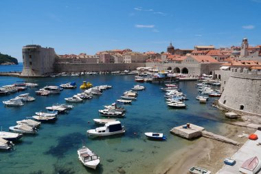 CROATIA, DUBROVNIK, JUNE 28, 2019: Boats in harbour in old town of Dubrovnik, Croatia