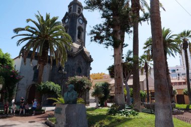 TENERIFE ISLAND, PUERTO DE LA CRUZ, SPAIN, SEPTEMBER 27, 2019: People near the church in Puerto de la Cruz city on Tenerife island, Canary islands, Spain