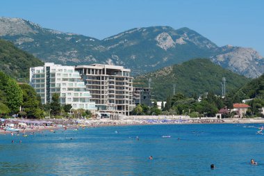 MONTENEGRO, PETROVAC, JULY 1, 2019: People on the beach in Petrovac city, Montenegro, Adriatic Sea