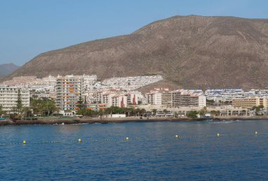 LOS CRISTIANOS, TENERIFE ISLAND, CANARY ISLANDS, SPAIN, OCTOBER 3, 2019: View on Los Cristianos city on Tenerife island, Canary islands. View from Volcan de Taburiente ferry