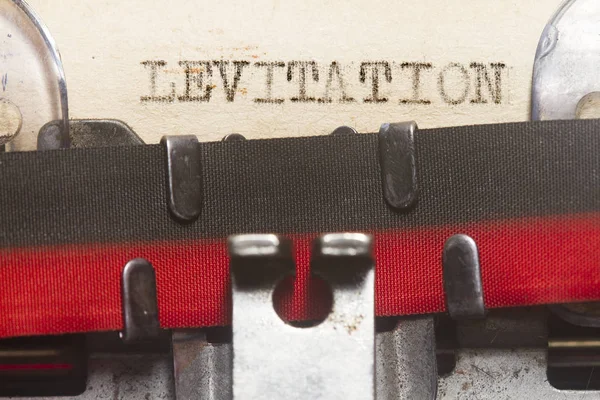 Levitação digitada em um velho papel vintage — Fotografia de Stock