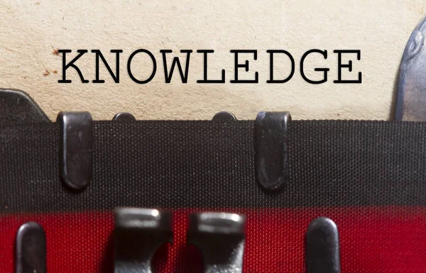 Knowledge typed on an old vintage paper — Stock Photo, Image