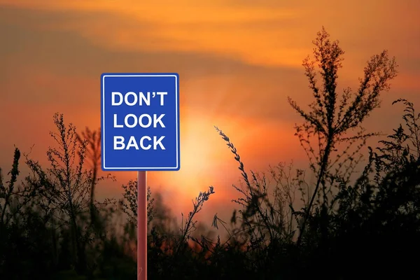 A sign warning a Don 't Look Back — стоковое фото