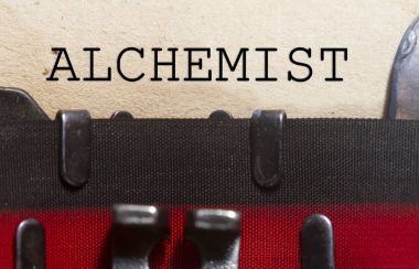 Alchemist typed on a vintage paper clipart