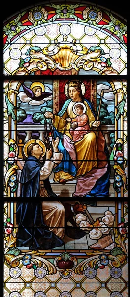 Jomfru Maria med Jesusbarnet og helgen Dominic – stockfoto