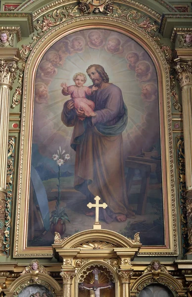 Saint Joseph holding çocuk İsa — Stok fotoğraf