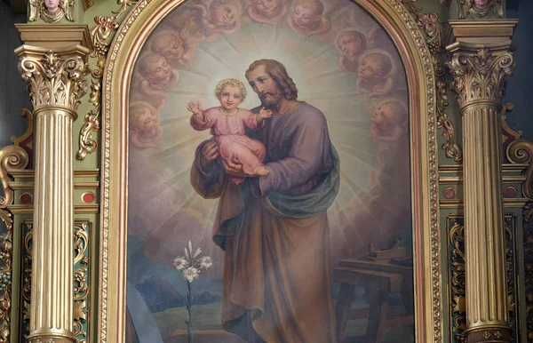 Saint Joseph anläggning barnet Jesus — Stockfoto