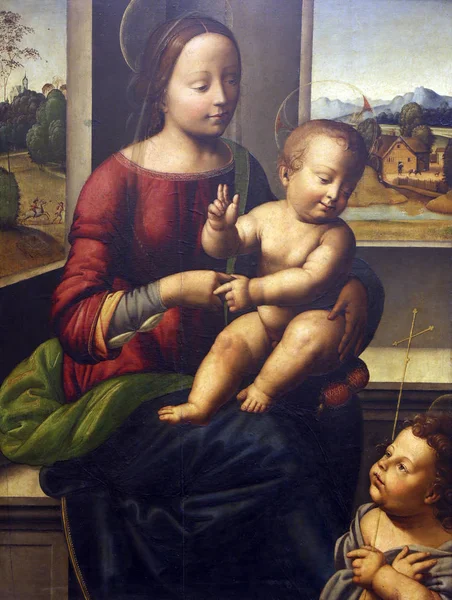 I henhold til Fra Bartolommeo: "Madonna og barnet med sankt Johannes – stockfoto