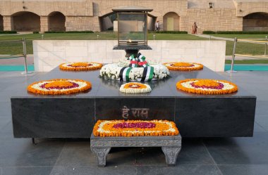 Rajghat, New Delhi. Memorial at Mahatma Gandhis body cremation place, Delhi, India on February, 13, 2016. clipart