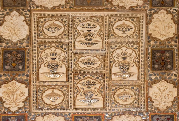 Detail of the mirrored ceiling in the Mirror Palace at Amber Fort in Jaipur, Rajasthan, India.