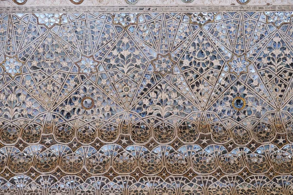 Detail of the mirrored ceiling in the Mirror Palace at Amber Fort in Jaipur, Rajasthan, India.