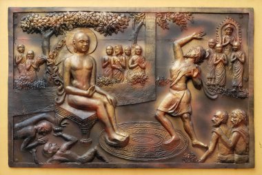 Kim bir çukur kazıyor içinde düşüyor. Gosalaka Tejolesya fırlatır - Mahavira ama o da kendini yakmak için ateşli alev yanmış, Street kabartma duvardaki Jain (Parshwanath Tapınağı olarak da bilinir) tapınakta Kalküta, Batı Bengal, Hindistan.