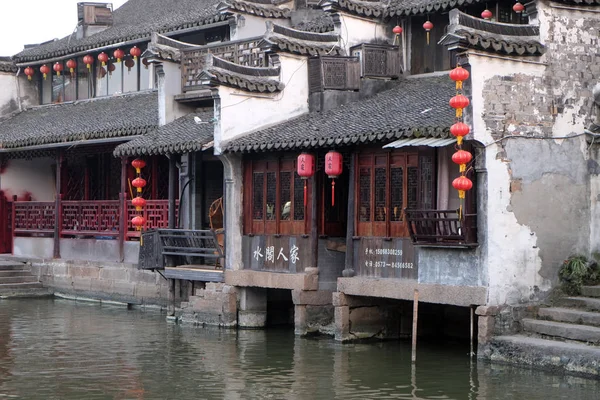 Chinese architecture and buildings lining the water canals to Xitang town in Zhejiang Province, China.