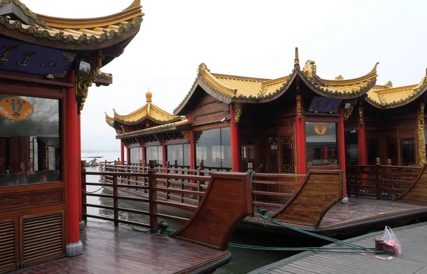 Traditional boat restaurant at the West Lake (Xi hu lake), freshwater lake in Hangzhou. UNESCO World Heritage Site, Hangzhou, China.