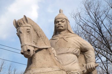 Stone statue of Ming Dynasty general Qi Jiguang, Shuiguan Great Wall, Badaling, Yanqing, China. clipart