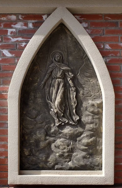 Assumption of the Blessed Virgin Mary into Heaven, the outer wall of the cathedral of St. Ignatius in Shanghai, China.