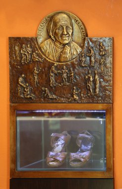 Relief with scenes from the life of Saint Mother Teresa of Calcutta, Chapel of Saint Dismas in Zagreb, Croatia. clipart