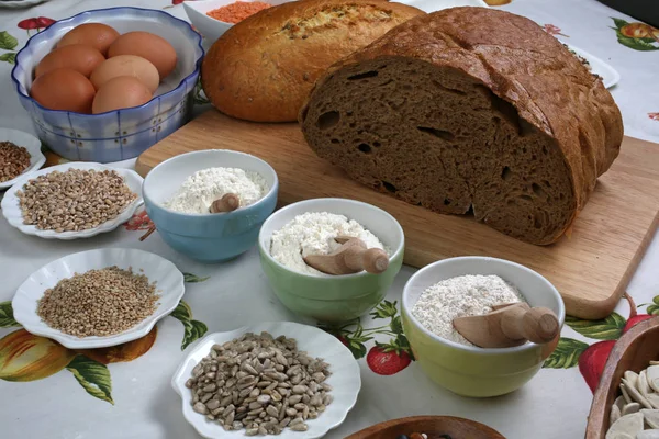 Ingredients for whole grain healthy bread, whole wheat flour, wheat germ and eggs.
