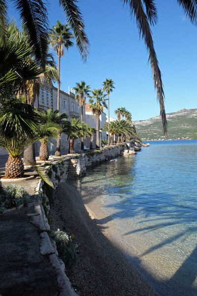 Seafront view at picturesque medieval Dalmatian town Korcula, Croatian culture and historic destination.