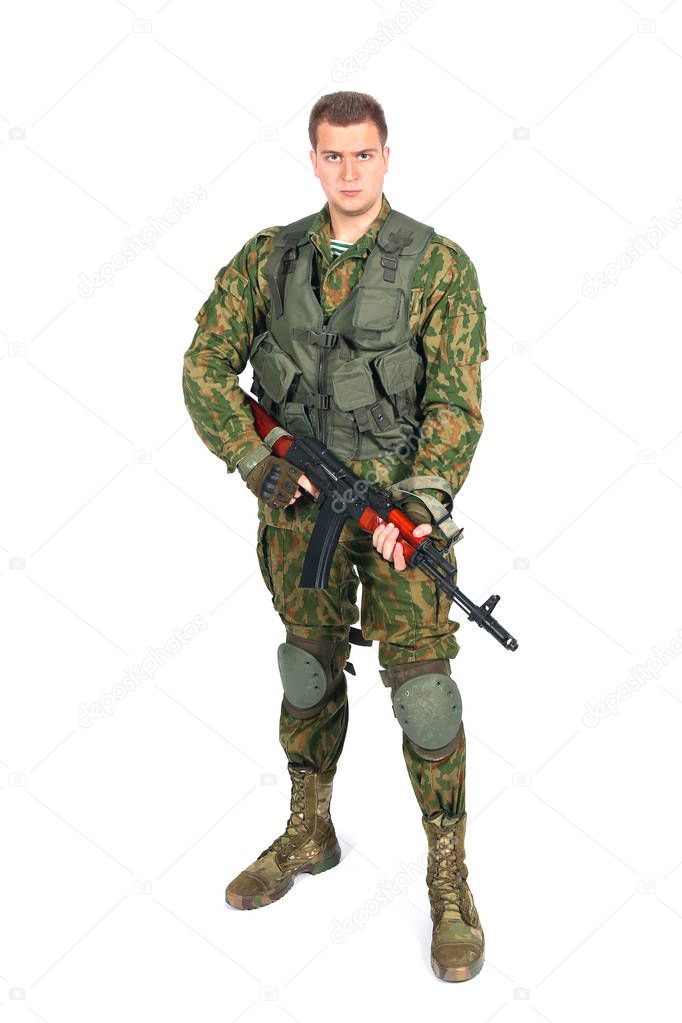 Military serviceman with rifle on white