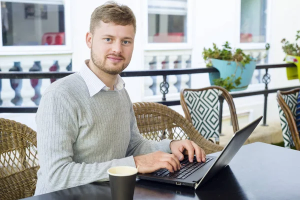 Young freelancer works in out of office