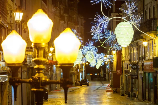 View on an ancient european illuminated street at christmas night — Stock Photo, Image