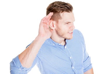 Man with impaired hearing struggling to hear frowning as he holds his hand to his ear in an attempt to improve acoustics clipart