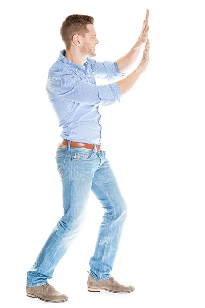 Businessman pushing invisible wall against white background — Stock Photo, Image