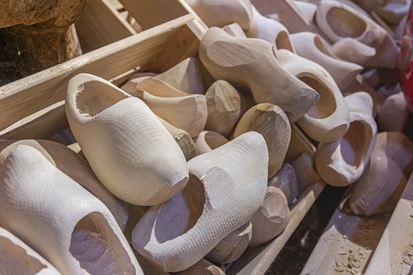 Manufacturing wooden shoes Klompen (clogs) in Holland. National traditional Dutch wooden shoes. Clog and Klomp Workshop. machine and part blanks.