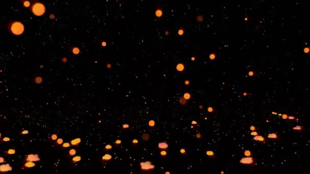 Falling orange fireballs on a dark surface — Stock Video