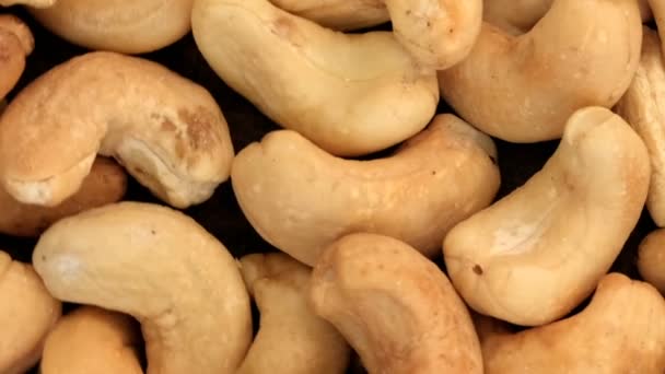 Spořič Obrazovky Potravinami Rotující Pozadí Pražených Ořechů Kešu Ořechů Zblízka — Stock video